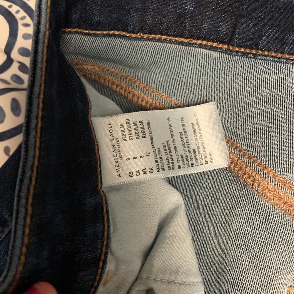 Cropped ae jeans with tussled bottoms to add flare